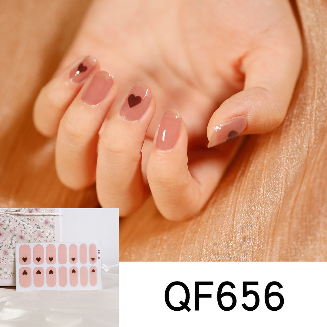 Artificial nail art with heart-shaped designs and soft color gradients Stornfield