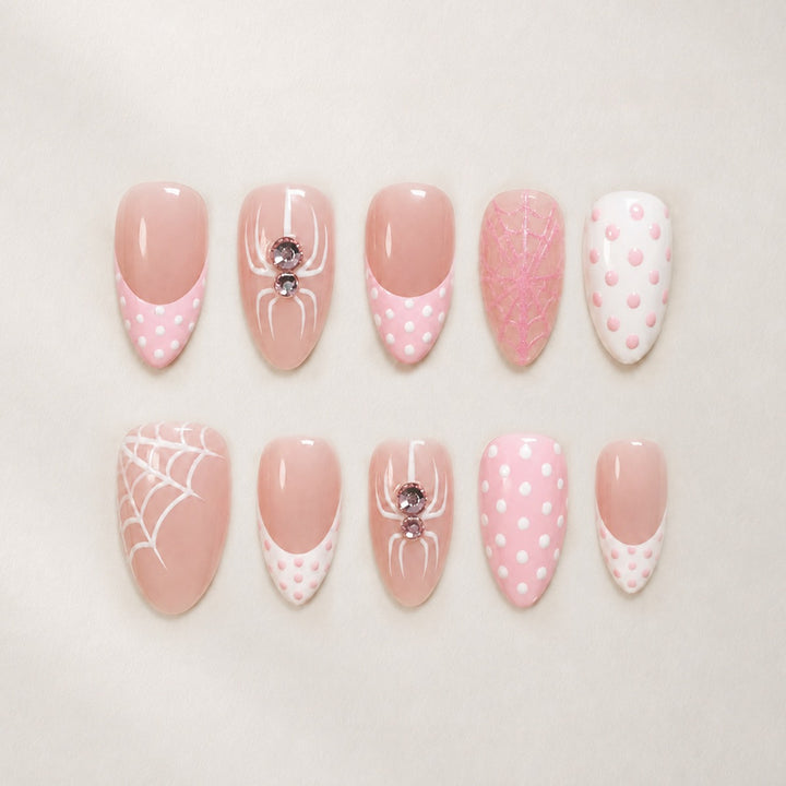 Artificial nail set with playful spider and polka dot motifs Stornfield