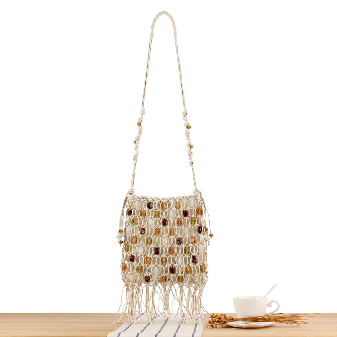 Hand-knotted shoulder bag with decorative beads and fringes Stornfield
