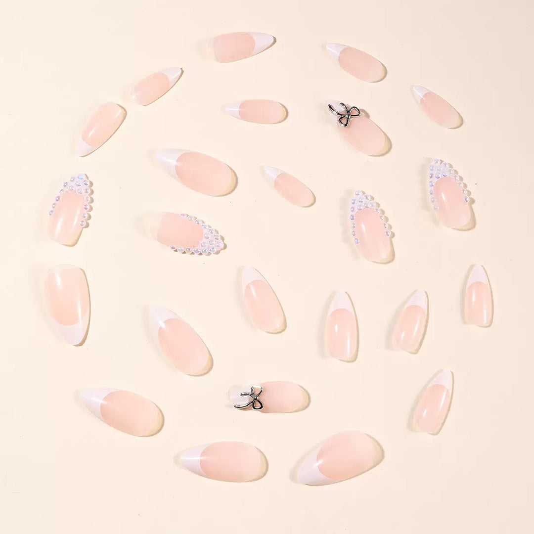 Acrylic nail set with elegant pearl and bow decorations Stornfield