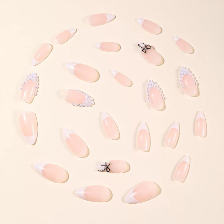 Acrylic nail set with elegant pearl and bow decorations Stornfield