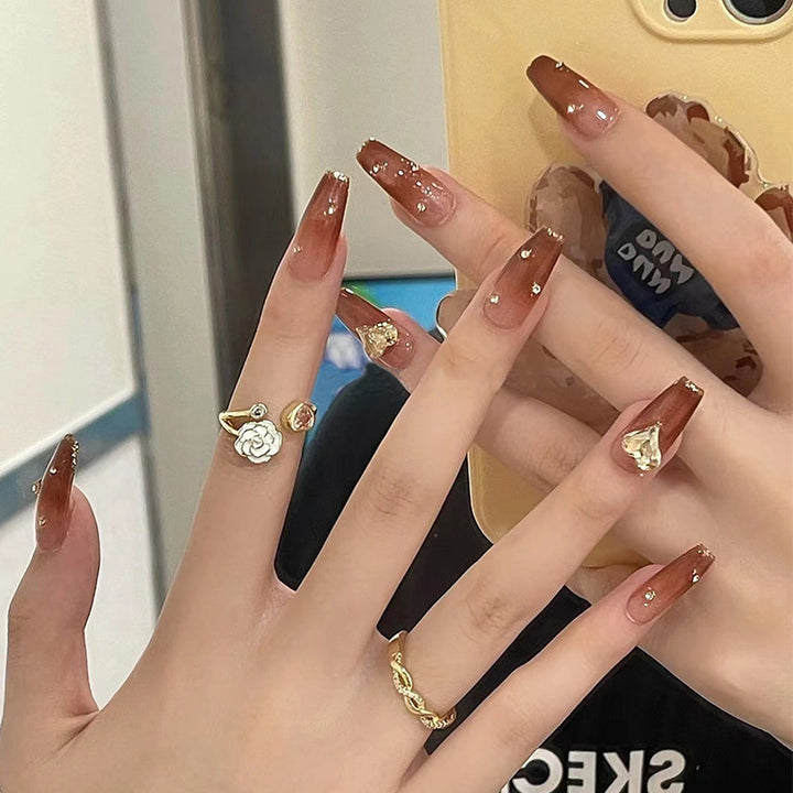 Glamorous artificial nails with sparkling accents Stornfield