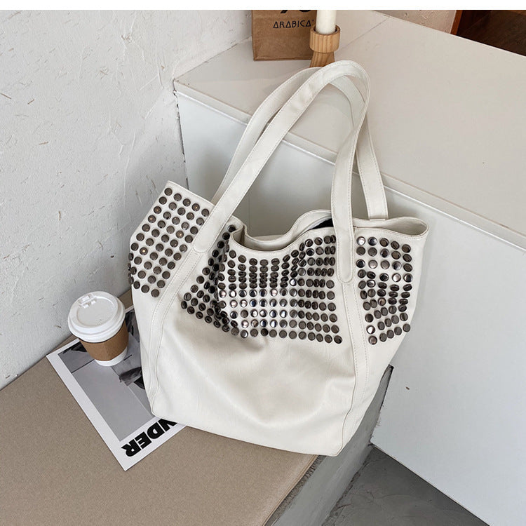 Fashionable shoulder bag with stylish rivet details Stornfield