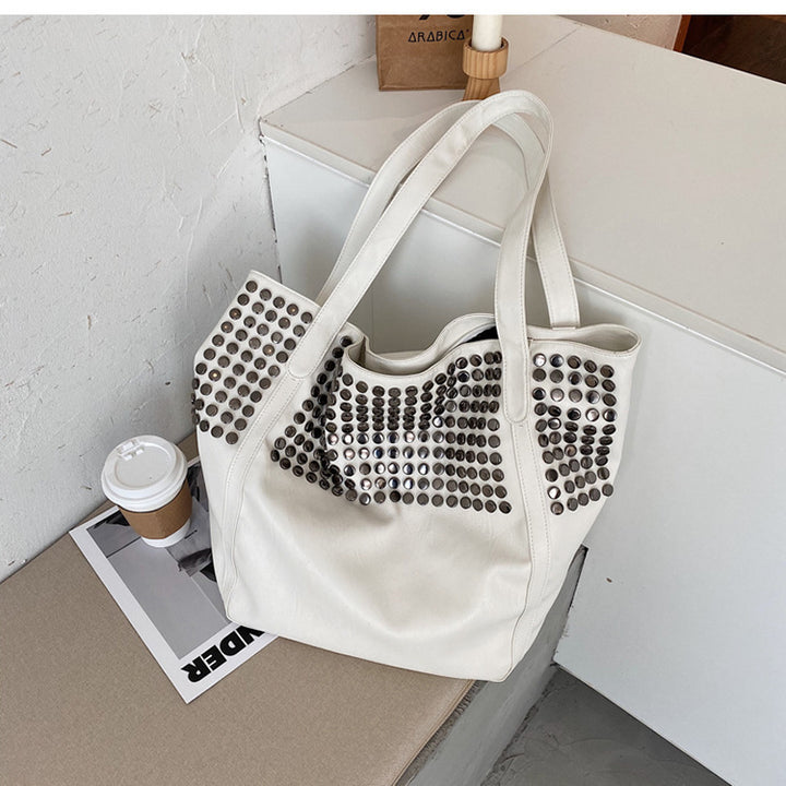 Fashionable shoulder bag with stylish rivet details Stornfield