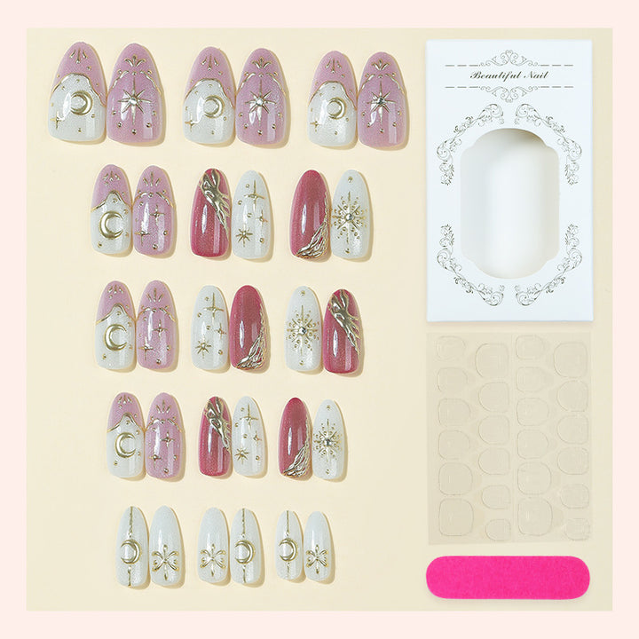 Artificial nail set with delicate gold embellishments and mystical motifs Stornfield