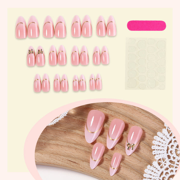 Artificial nail set with elegant gold edge and decorative accents Stornfield