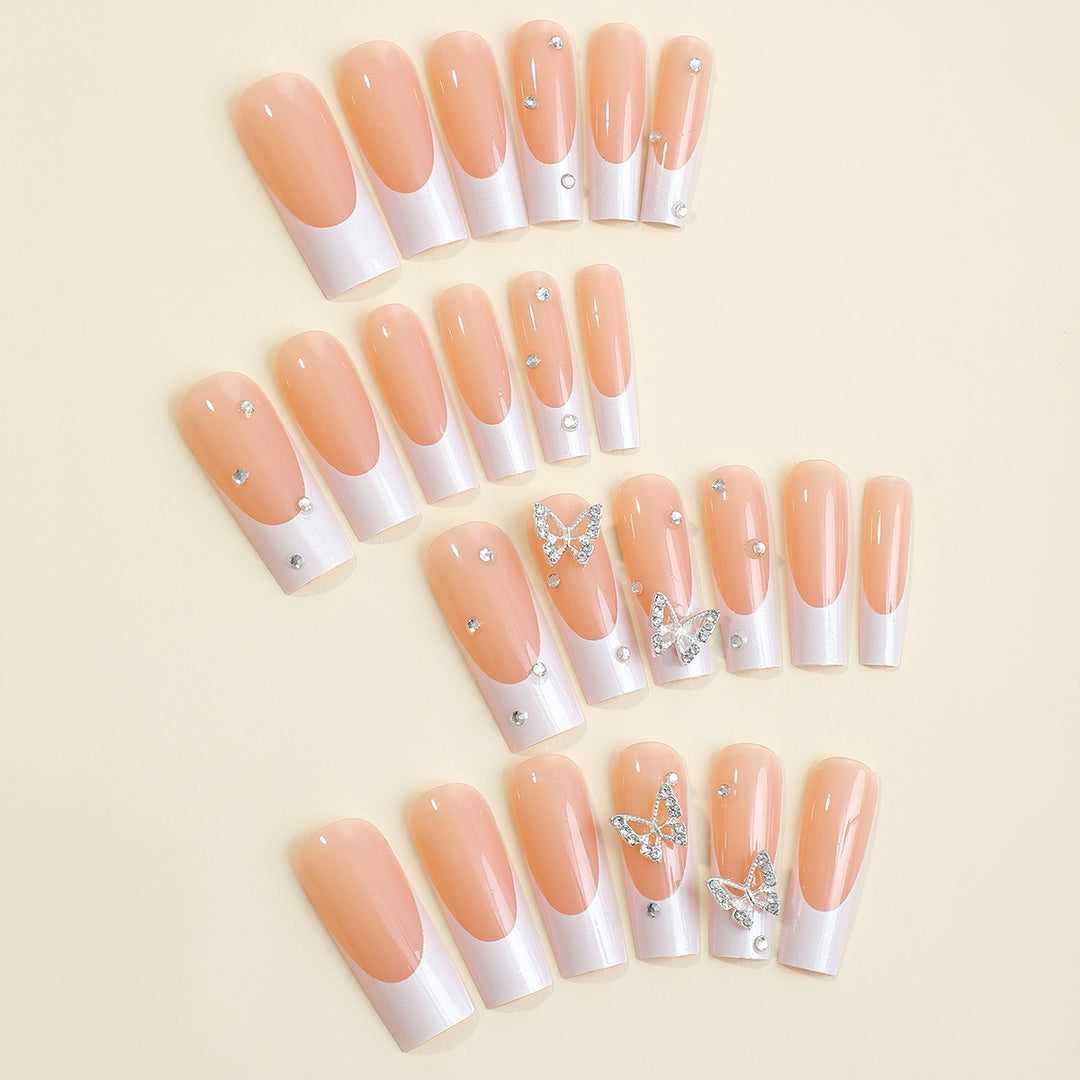 Artificial nail set with luxurious glitter and delicate floral designs Stornfield