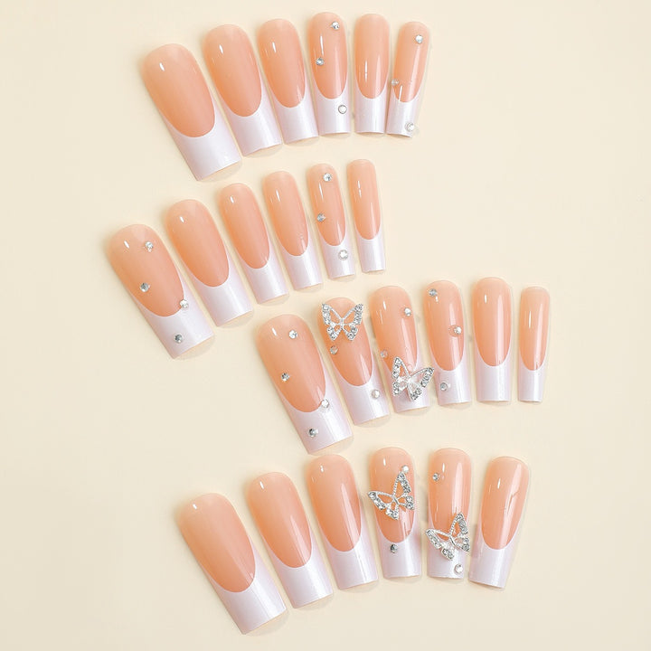 Artificial nail set with luxurious glitter and delicate floral designs Stornfield