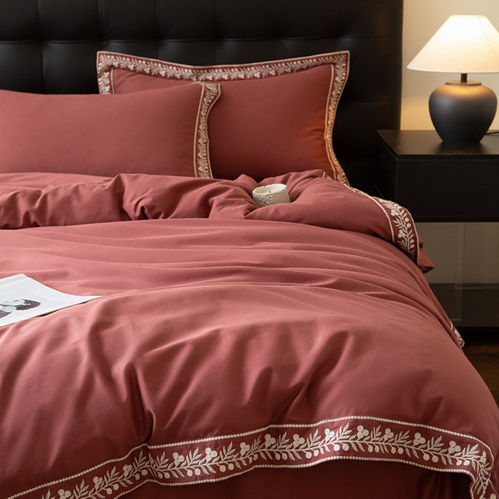 Luxurious embroidered bedding set in cotton satin with decorative trim