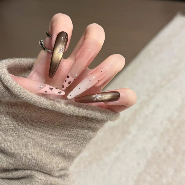 Artistic Stiletto Nail Extensions with Patterned Designs