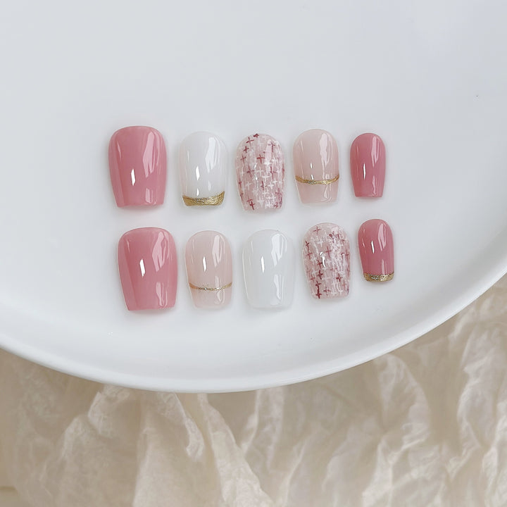 Elegant Press-On Nail Art Set with Gold and Pink Accents