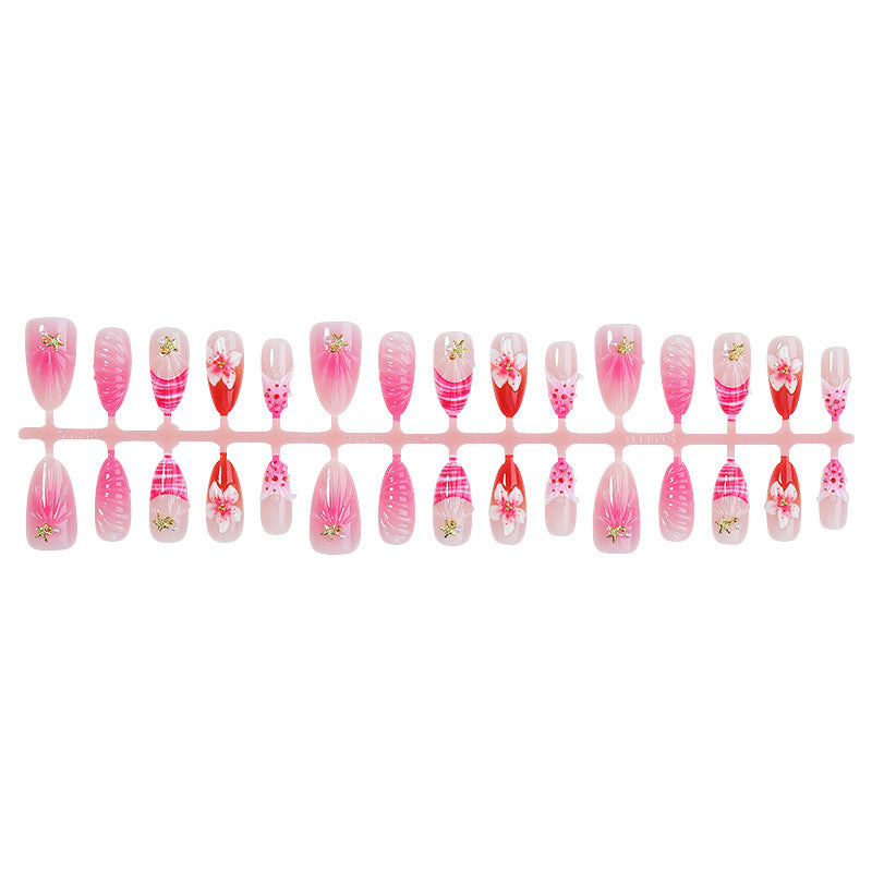 Acrylic nail set with luxurious glitter and flower accents Stornfield