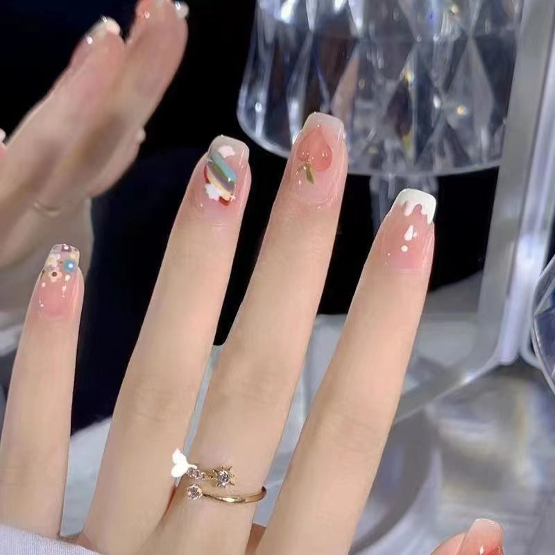 Creative nail art with fruit and flower motifs Stornfield