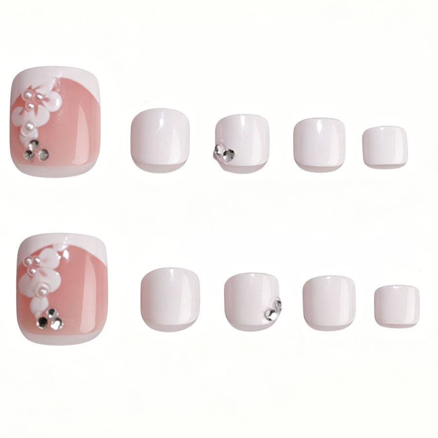 Nail art set with elegant flower design and glitter accents Stornfield