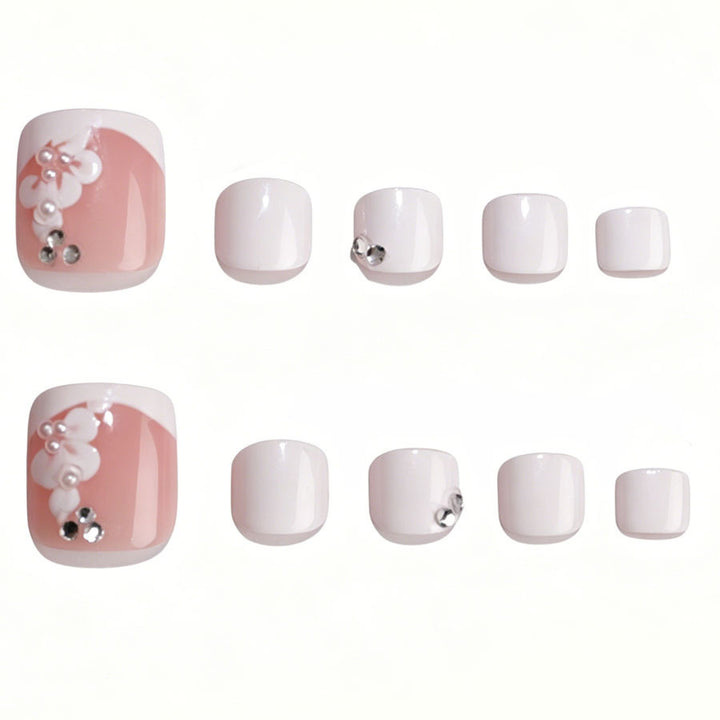 Nail art set with elegant flower design and glitter accents Stornfield