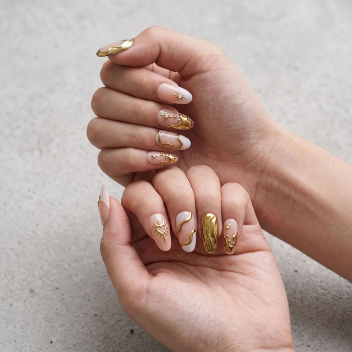Artistic Gold Embellished Nail Art Stornfield