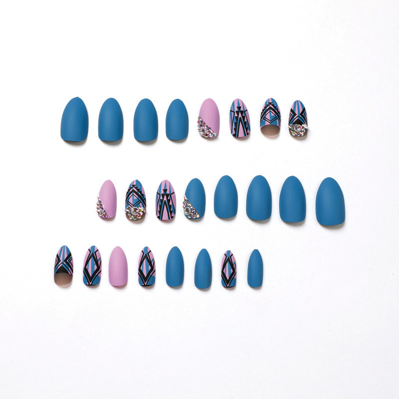 Artful stiletto nails with modern geometric designs and rhinestone embellishments Stornfield