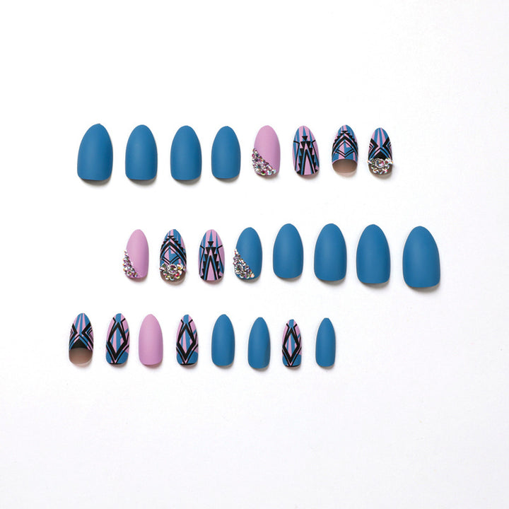 Artful stiletto nails with modern geometric designs and rhinestone embellishments Stornfield