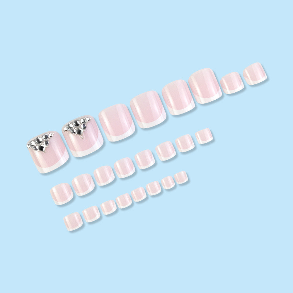 Nail art set with elegant French tips and sparkling rhinestone details Stornfield