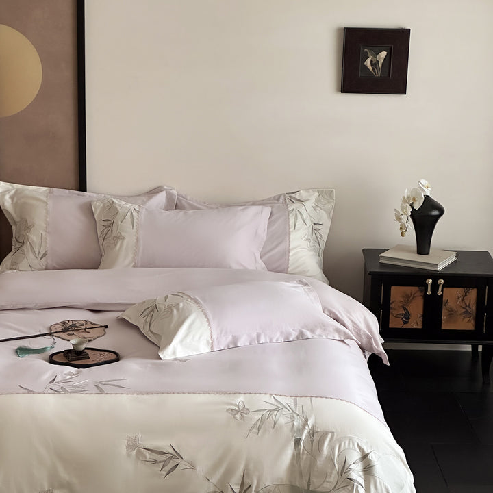 Elegant cotton satin bedding set with embroidered bamboo and butterfly border