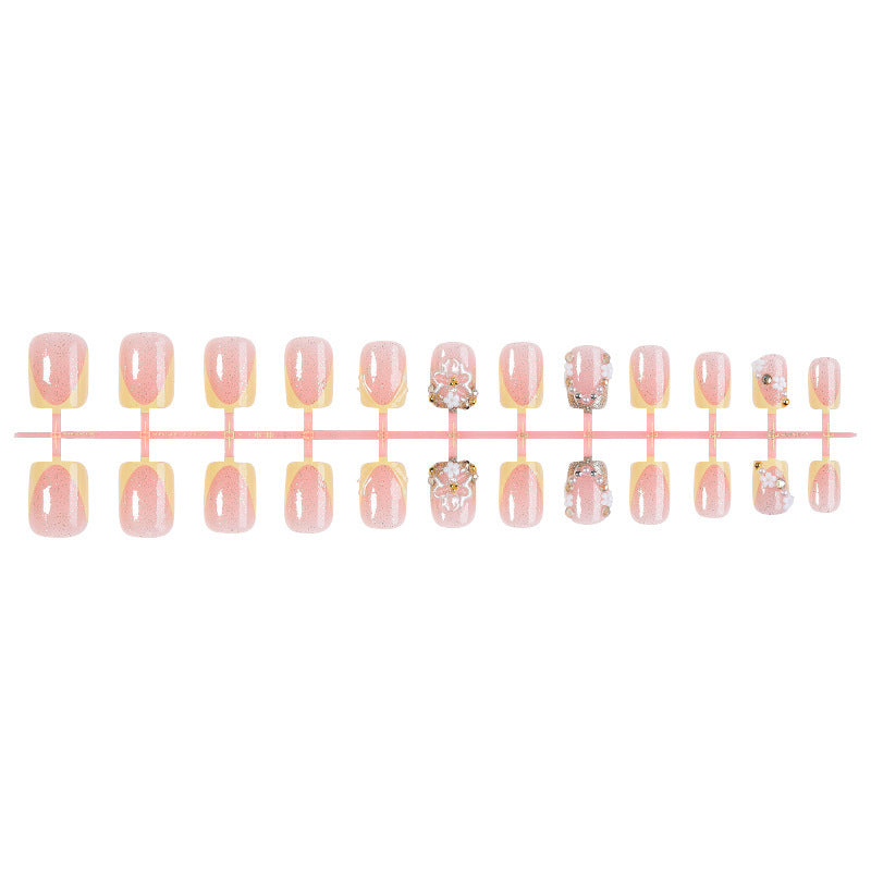Artificial nail set with floral design and glamorous embellishments Stornfield