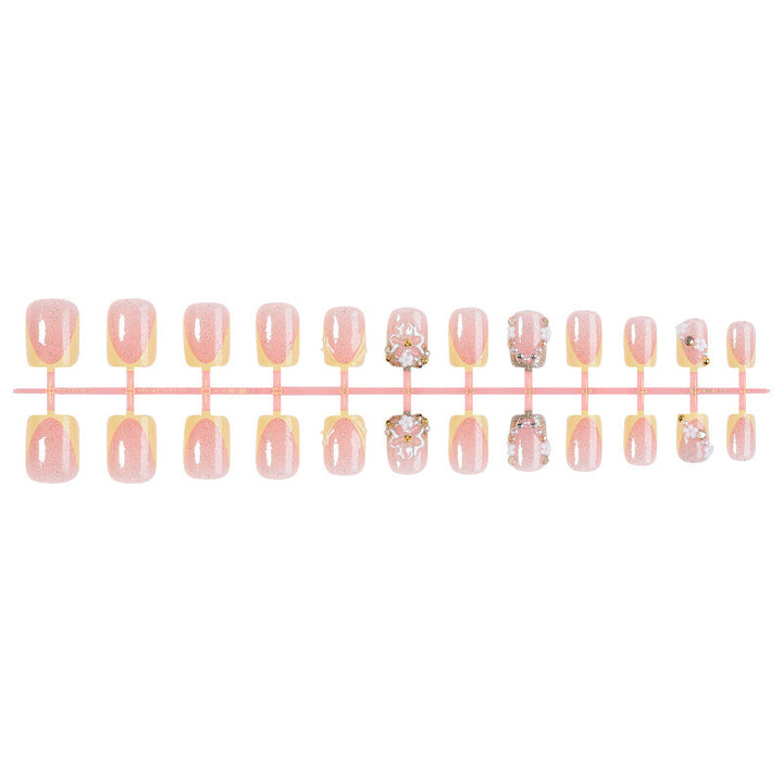 Artificial nail set with floral design and glamorous embellishments Stornfield