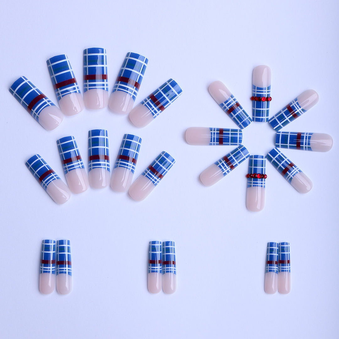 Artificial nails with plaid pattern and glitter stones Stornfield