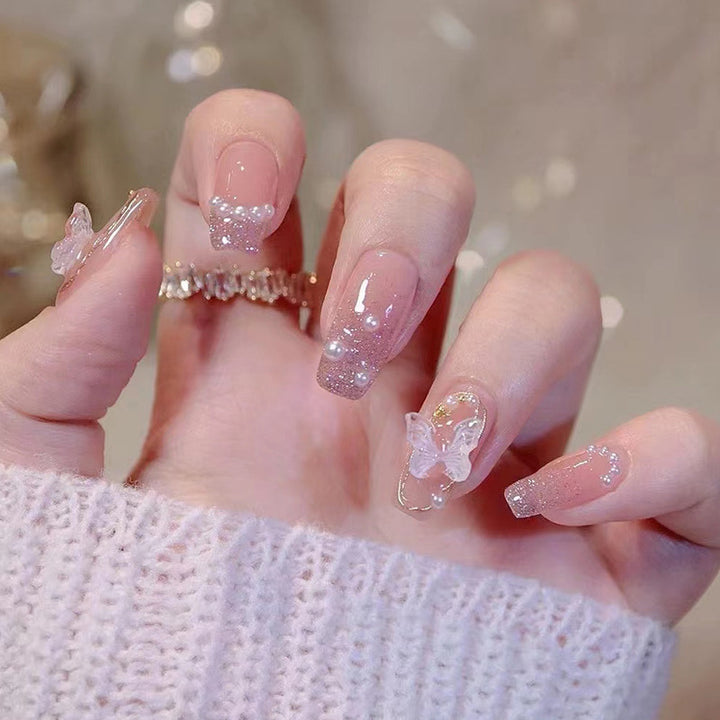Glamorous artificial nails with heart and glitter details Stornfield