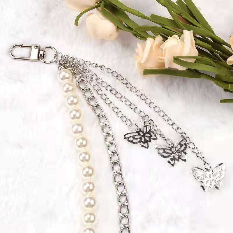 Fashionable belt with pearl and chain pendants Stornfield