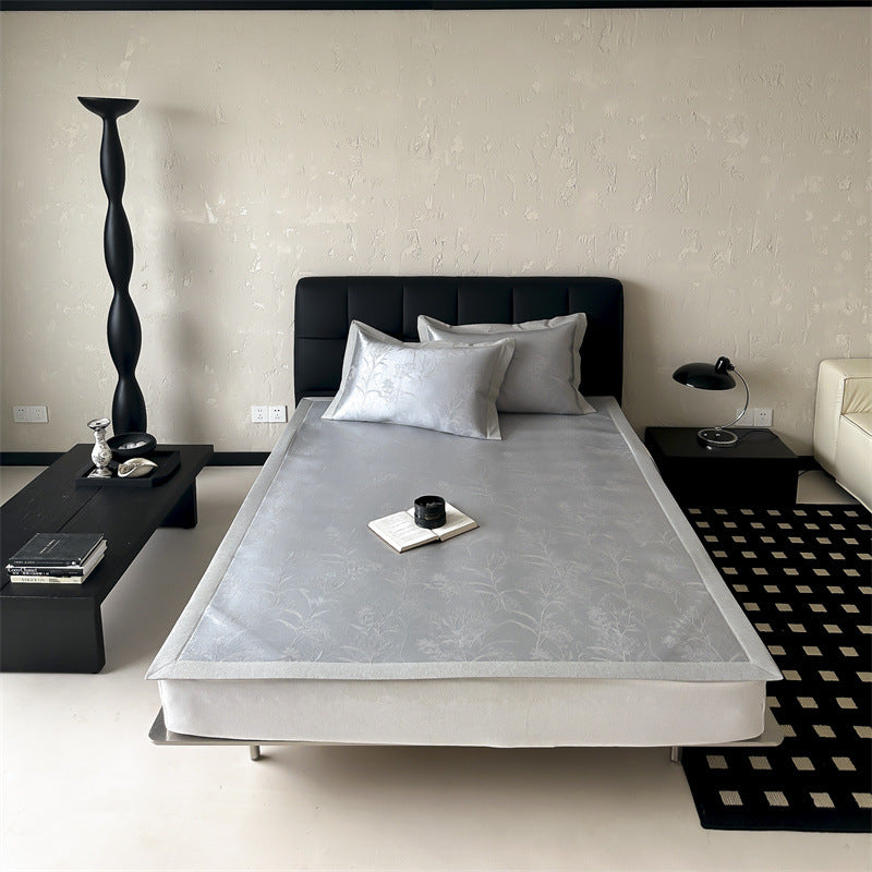 high-quality non-slip mattress protector with integrated fitted sheet and elegant jacquard pattern