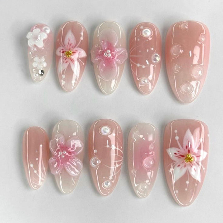 Artful stiletto nails with elegant floral design and glitter details Stornfield