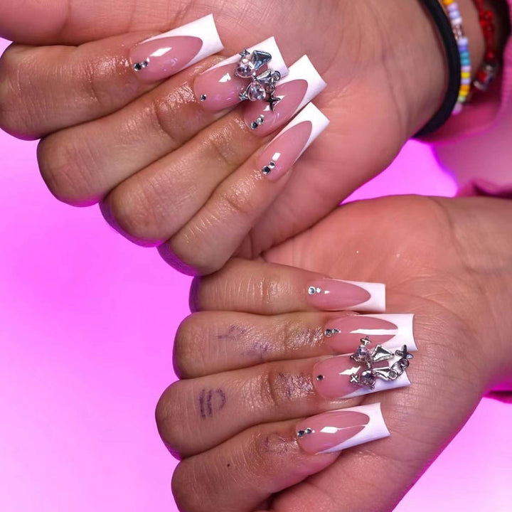 Artificial nail set with luxurious French tips and elegant embellishments Stornfield