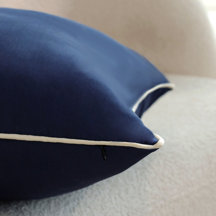 Square cushion cover with contrasting piping and microvelours surface Stornfield