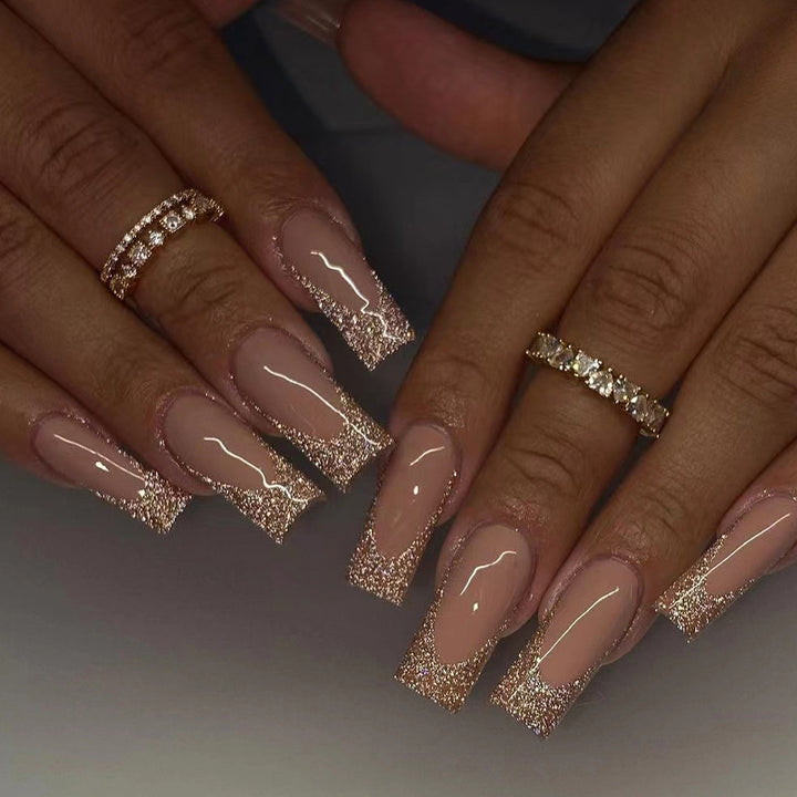 Artificial nail art with glitter and transparent design Stornfield