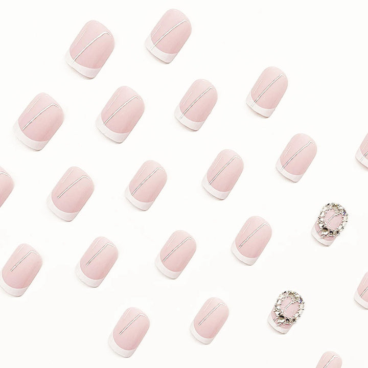 Artificial nail set with elegant French design and rhinestone embellishments Stornfield