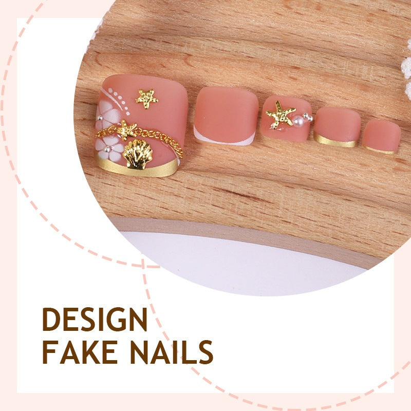 Artificial nail set with elegant, floral accents and golden decorations Stornfield
