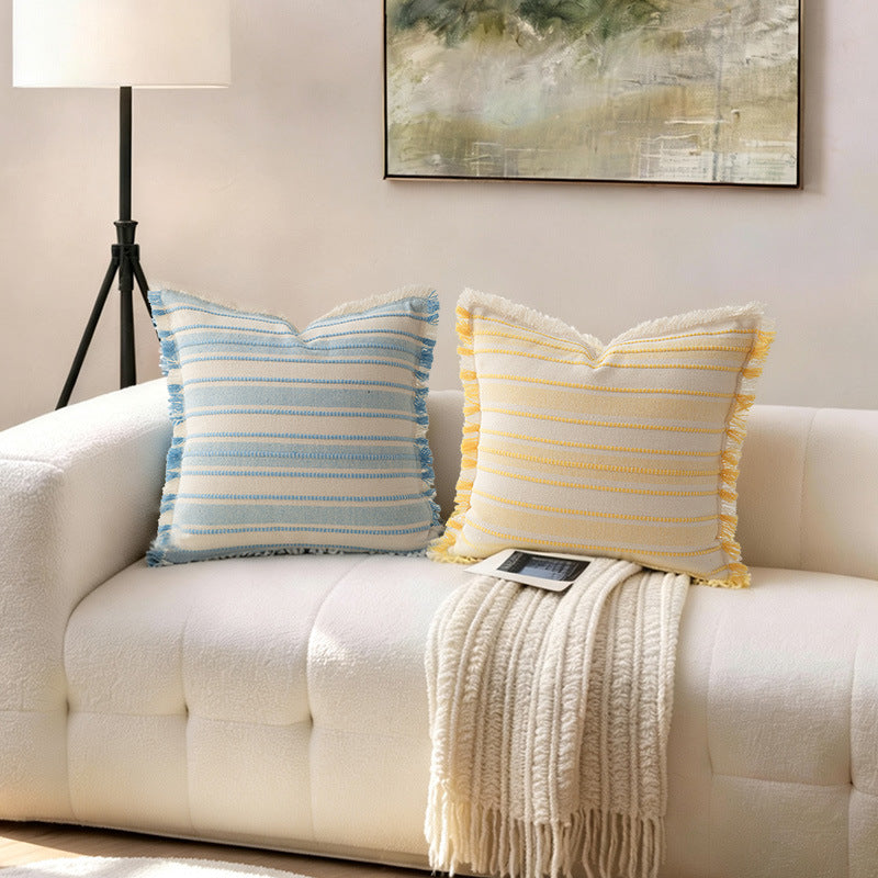 Square cushion cover made of hand-woven cotton blend with decorative fringe trim Stornfield