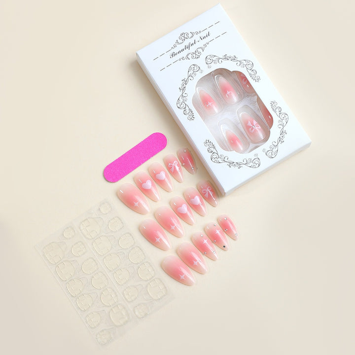 Artificial nail set with romantic hearts and elegant bows Stornfield