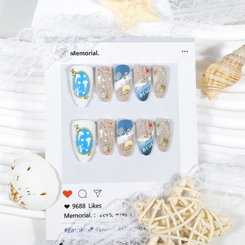 Artificial nail set with maritime designs and elegant embellishments Stornfield