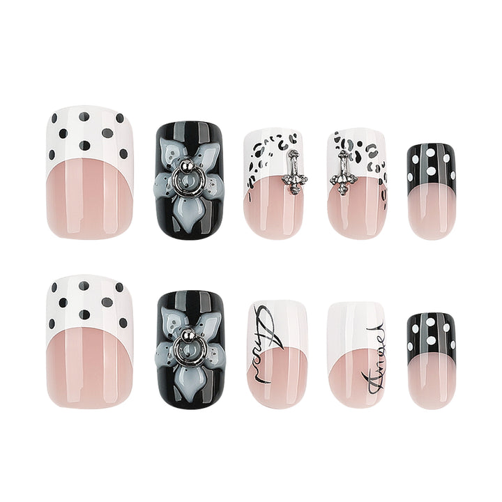 Artful nail extensions with elegant black-and-white design Stornfield