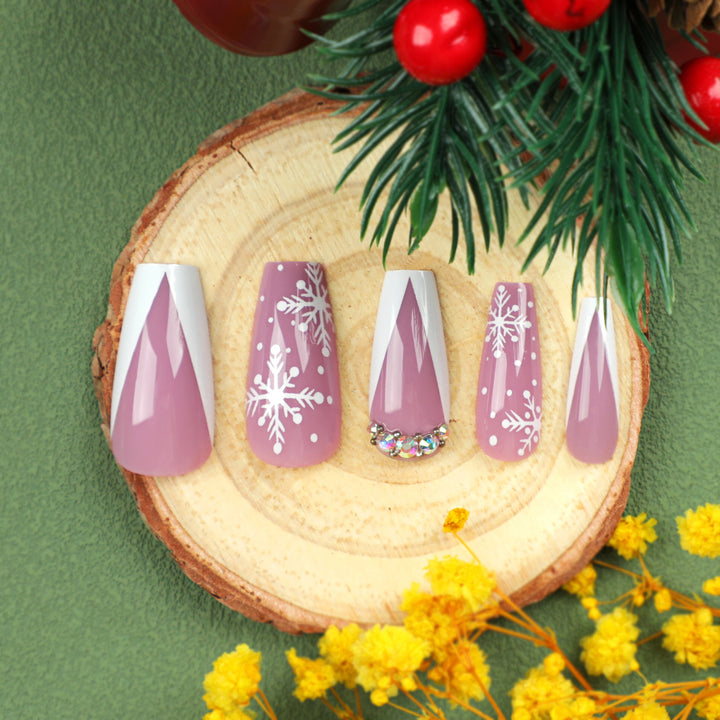 Artistic Nail Extensions with Snowflake Design and Glitter Accents Stornfield
