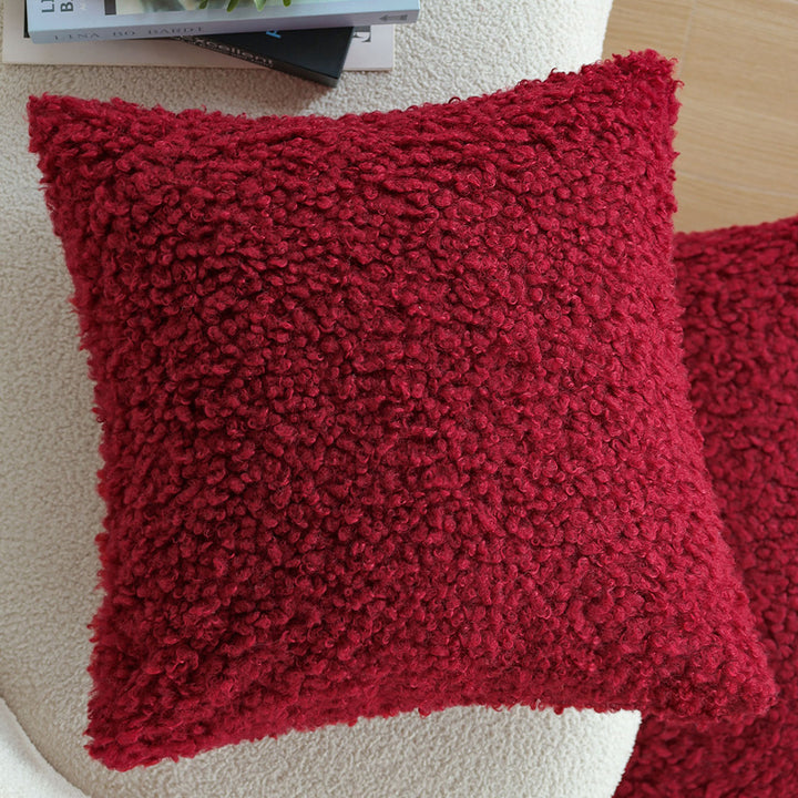Rectangular decorative cushion with bouclé relief and tassels Stornfield