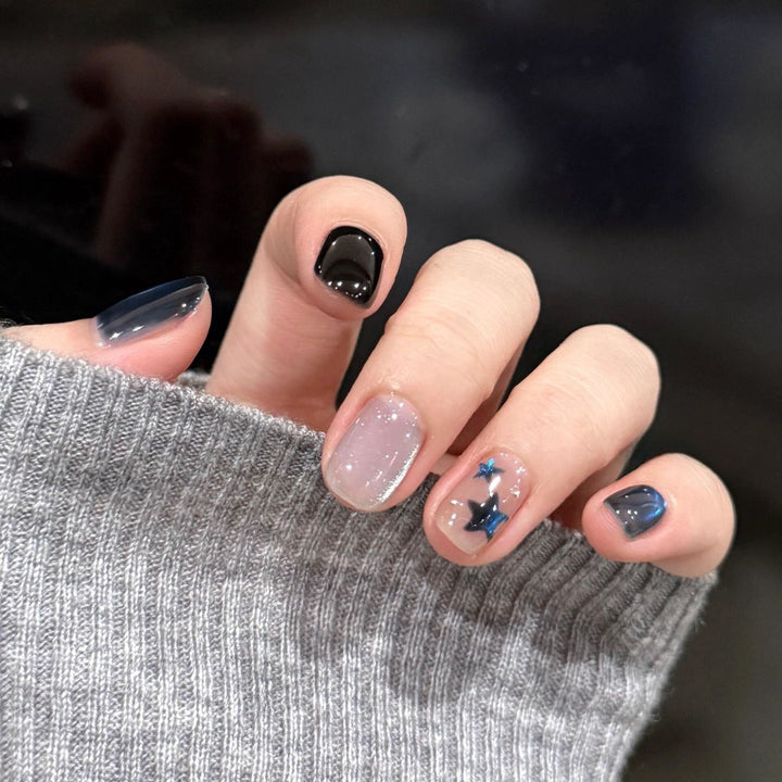 Artificial nails with elegant star design and shimmering effects Stornfield
