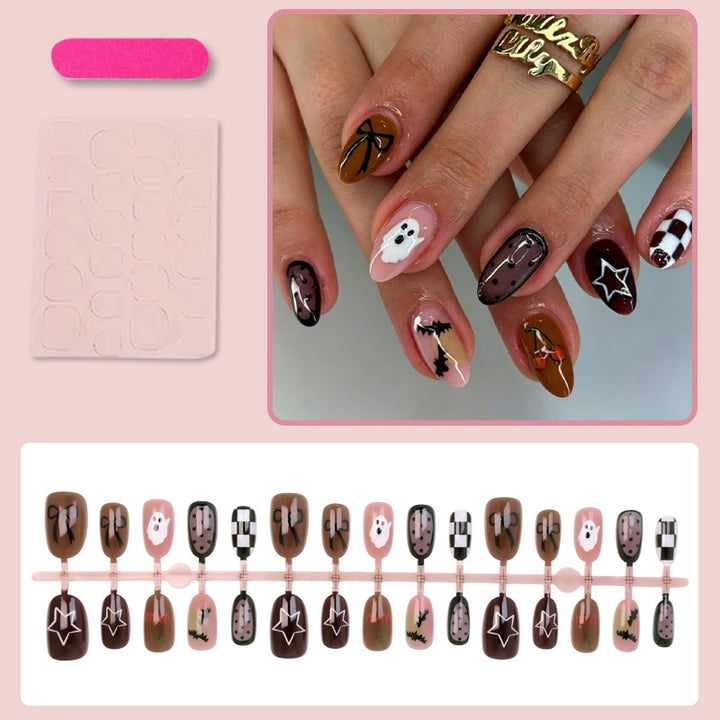Artificial nail set with creative Halloween designs and glittering accents Stornfield