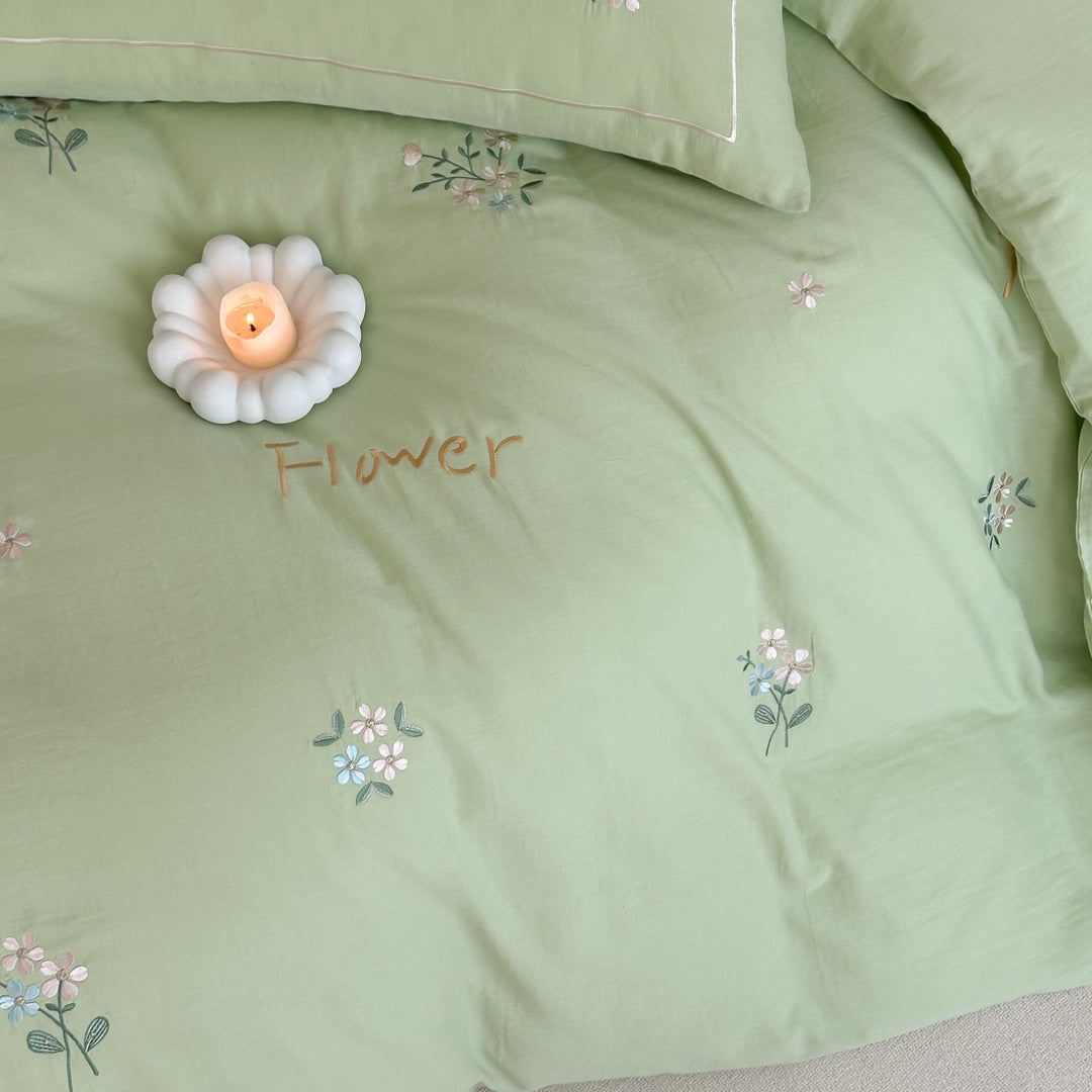 Delicate embroidered cotton bedding set with gentle botanical embroidery and bow ties Stornfield