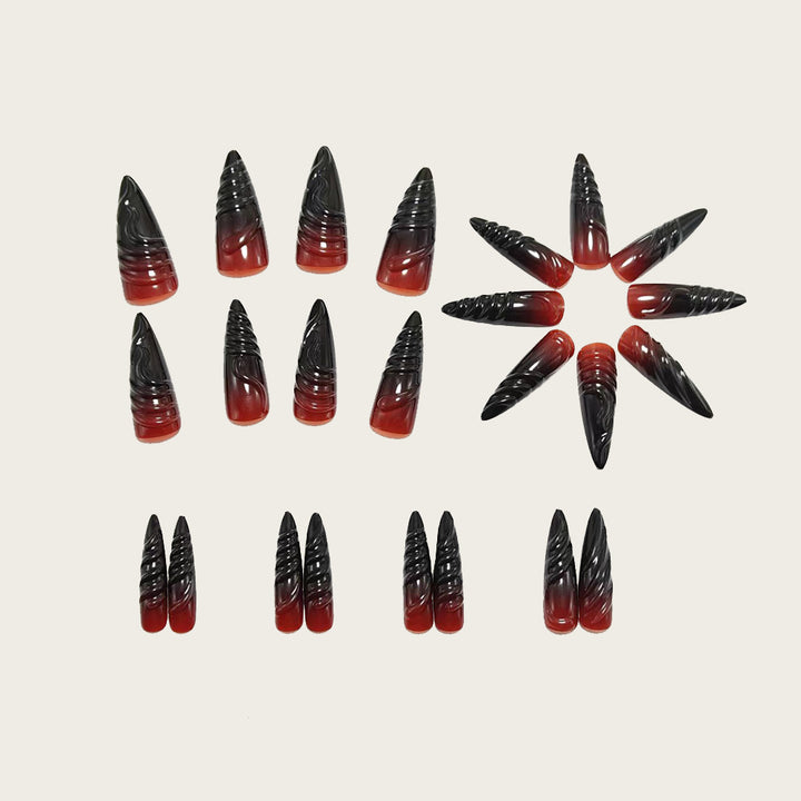 Gothic-style artificial nails with pointed tips and shiny surface Stornfield