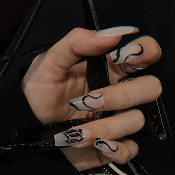 Acrylic nail set with elegant design and creative accents Stornfield
