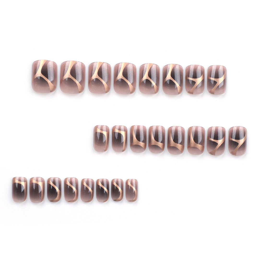 Artificial nail art with elegant metallic design and glitter accents Stornfield