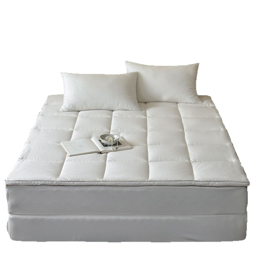 Padded comfort topper with quilted compartments and elastic corner bands