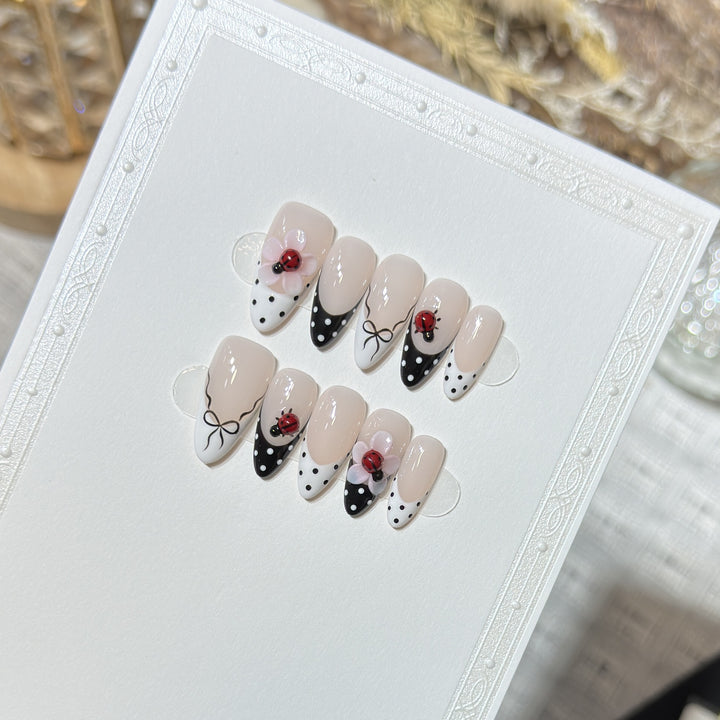 Artistic Stiletto Press-On Nail Set with Floral and Insect Designs Stornfield